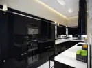 black-kitchen-with-white-countertop1-665x498.webp